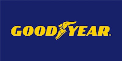 The gold Goodyear logo on a navy blue background