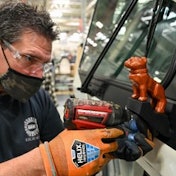 Mack assembly line worker working on LR Electric