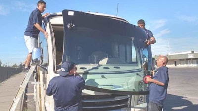 Freedom Truck & Trailer Parts team installing glass