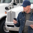 Driver with phone and tablet