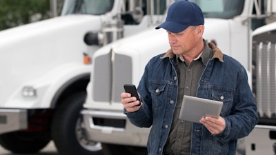 Driver with phone and tablet