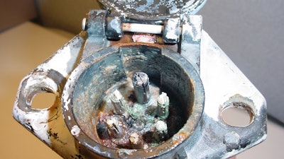 A 7-way connector for a trailer electrical system that has been degraded by corrosion.