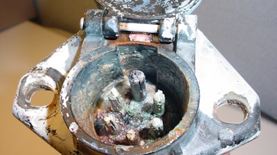 A 7-way connector for a trailer electrical system that has been degraded by corrosion.