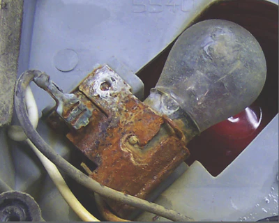 An incandescent trailer lamp no longer in use. New LED trailer lamps have a longer life cycle than their incandescent predecessors but can still be rendered inoperable when corrosion damages the connection to the LED.