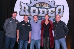 A group of people stand in front of a banner that says Tech Skills Rodeo Est. 2006.