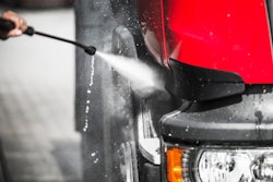 Truck being washed with pressure washer