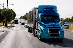 A hydrogen Hyzon-branded truck drives down the road.