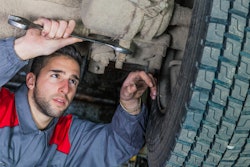 Technician on wheel end