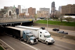 Trucks driving through Detroit on highway