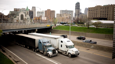 Trucks driving through Detroit on highway