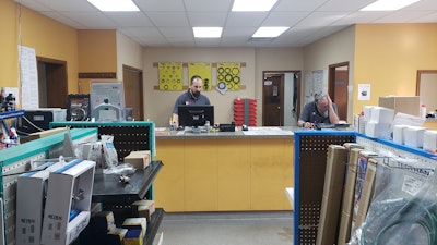 Crossroads Truck Equipment associates at workbench