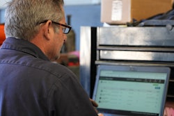 Man at computer using Excede 10.4