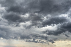 Cloudy sky with sun seeking through