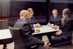 Group of businessmen in an office meeting