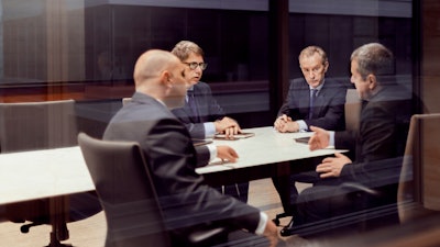 Group of businessmen in an office meeting