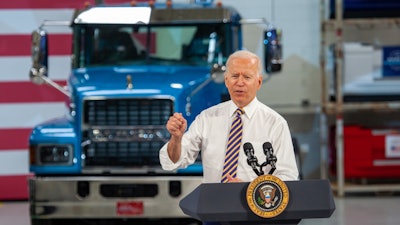 President Joe Biden speaking at a Mack Trucks facility
