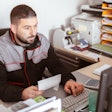 Technician sitting at computer