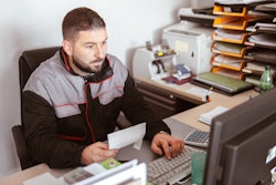 Technician sitting at computer