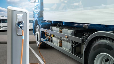 Electric truck charging at station