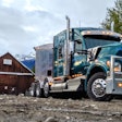 Kenworth Truck in mountains by old barn