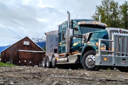 Kenworth Truck in mountains by old barn