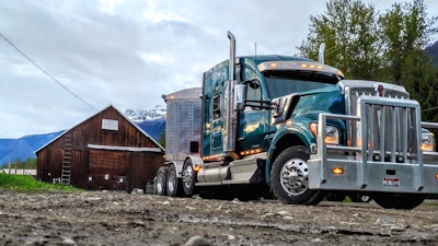 Kenworth Truck in mountains by old barn