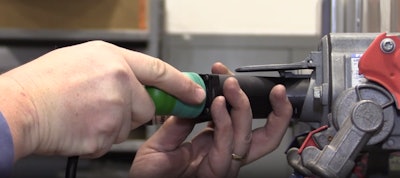 A technician performs an end-of-line test on a trailer antilock braking system.