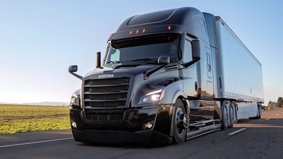 Freightliner Cascadia on roadway on sunny day