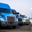 Line of trucks in row starting with blue truck