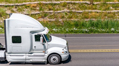 White truck going up hill