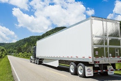 Utility reefer being pulled on highway