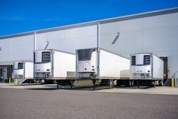 Reefer trailers parked at loading docks