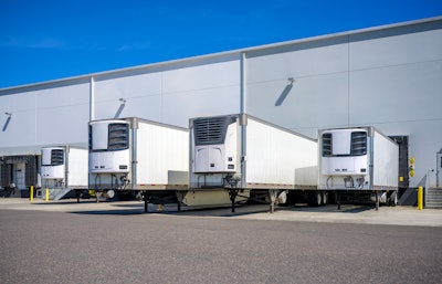 Reefer trailers parked at loading docks