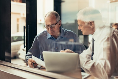 Two men in meeting having good conversation