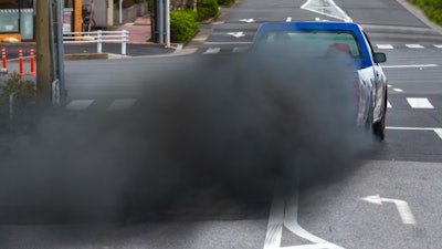 Pickup truck blowing smoke from exhaust pipe