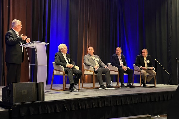 A panel discusses insurance claims at the HD Repair Forum.