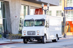 Xos stepvan on a road in an urban area
