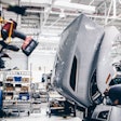 Man working at a truck production facility