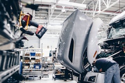 Man working at a truck production facility