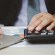 Man making financial calculation
