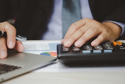 Man making financial calculation