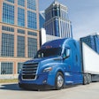 Freightliner Cascadia on a highway in a city