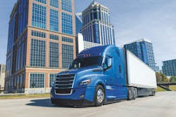 Freightliner Cascadia on a highway in a city
