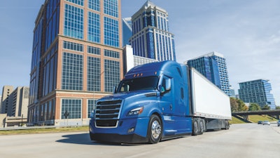 Freightliner Cascadia on a highway in a city