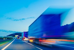 Line of trucks with trailers moving fast