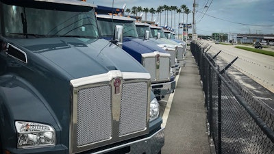 Kenworth trucks in a row