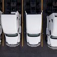 Group of white trucks from above