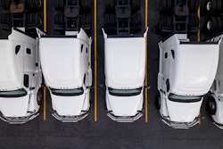 Group of white trucks from above