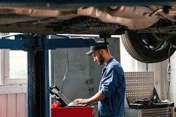 Technician using computer in a shop