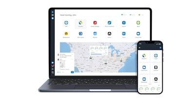 A laptop and a smartphone showing a dashboard for Trucking Hub's software.